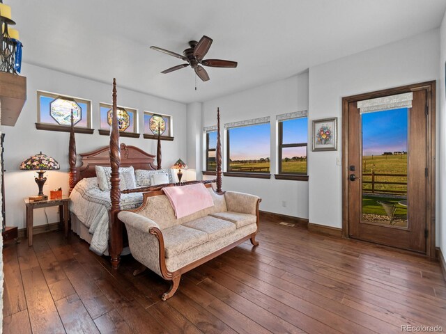 3124 Antelope Ridge Trl, Parker, CO 80138 - bedroom featuring access to exterior, dark wood-style floors, and ceiling fan