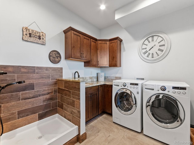 3124 Antelope Ridge Trl, Parker, CO 80138 - washroom featuring washer and dryer and cabinet space