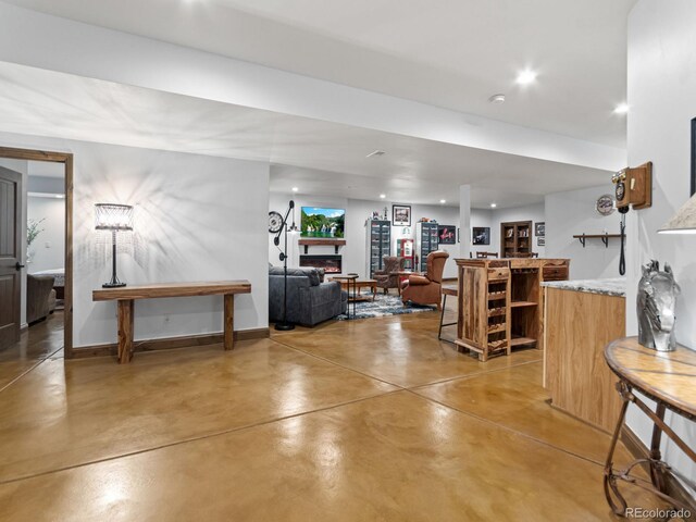 3124 Antelope Ridge Trl, Parker, CO 80138 - living room with concrete flooring, recessed lighting, and bar area