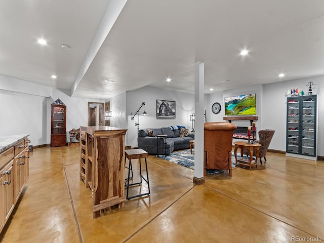 3124 Antelope Ridge Trl, Parker, CO 80138 - living room featuring recessed lighting, concrete flooring, and bar area