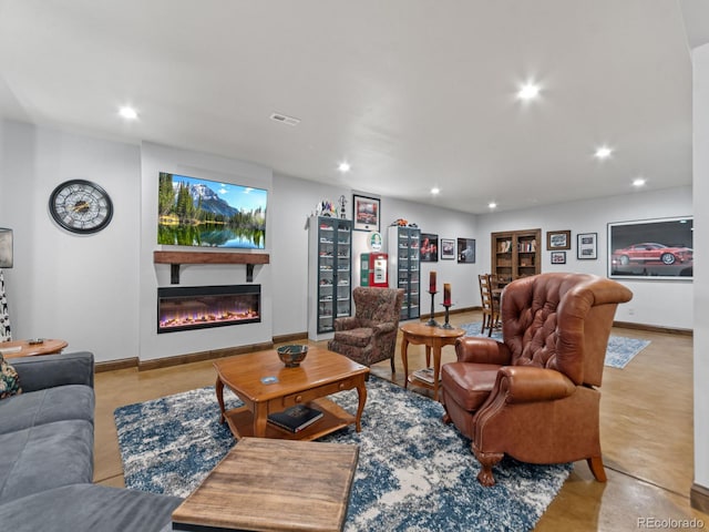 3124 Antelope Ridge Trl, Parker, CO 80138 - living area featuring recessed lighting, a glass covered fireplace, and concrete floors