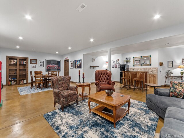 3124 Antelope Ridge Trl, Parker, CO 80138 - living room featuring recessed lighting, bar area, and concrete flooring