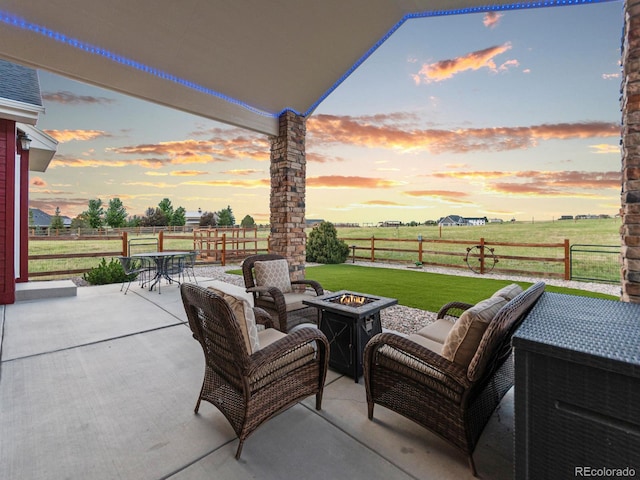 3124 Antelope Ridge Trl, Parker, CO 80138 - patio terrace at dusk with a patio, an outdoor living space with a fire pit, a rural view, and outdoor dining area