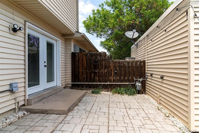 view of patio / terrace featuring french doors and fence