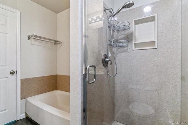 1202 S Troy St, Aurora, CO 80012 - bathroom featuring a shower stall and a garden tub