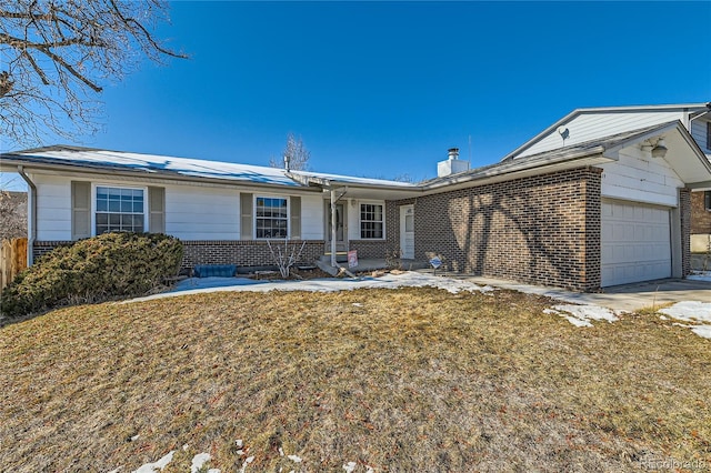 ranch-style home with a garage and a front yard