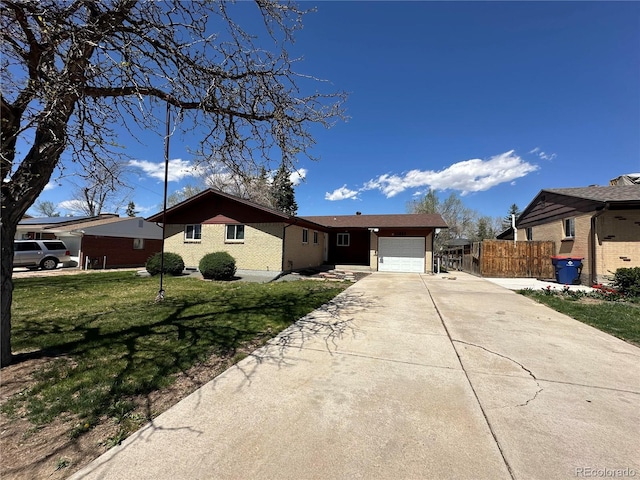 11623 E Virginia Dr, Aurora, CO 80012 - ranch-style home featuring fence, driveway, a front yard, and a garage