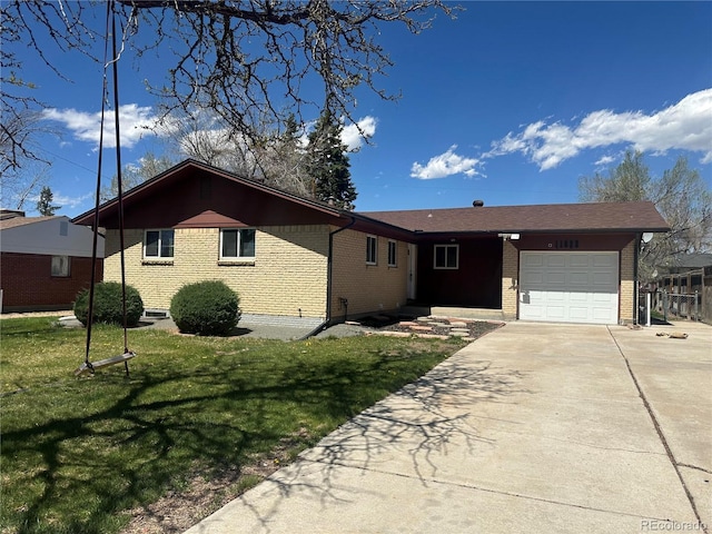 11623 E Virginia Dr, Aurora, CO 80012 - ranch-style home with brick siding, an attached garage, a front lawn, and driveway