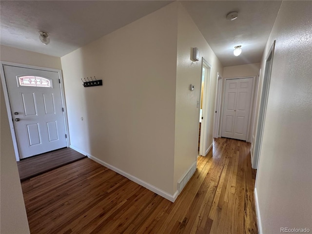 11623 E Virginia Dr, Aurora, CO 80012 - foyer entrance with baseboards, visible vents, and light wood-style flooring