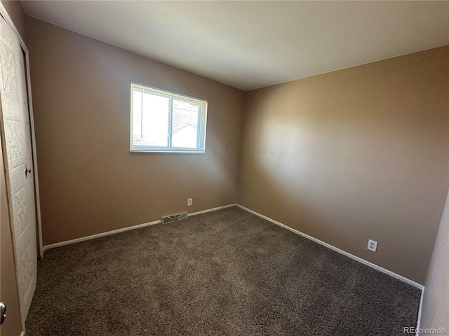 11623 E Virginia Dr, Aurora, CO 80012 - unfurnished room with baseboards, carpet flooring, and visible vents