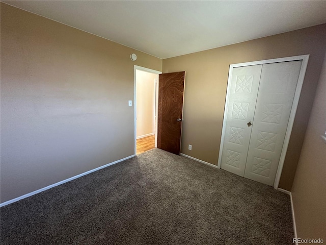 11623 E Virginia Dr, Aurora, CO 80012 - unfurnished bedroom with a closet, carpet flooring, and baseboards
