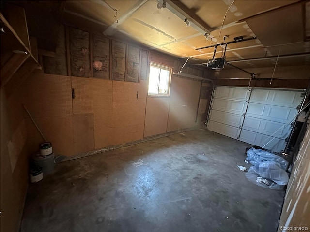 11623 E Virginia Dr, Aurora, CO 80012 - garage featuring a garage door opener