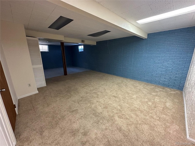 11623 E Virginia Dr, Aurora, CO 80012 - below grade area with brick wall and carpet