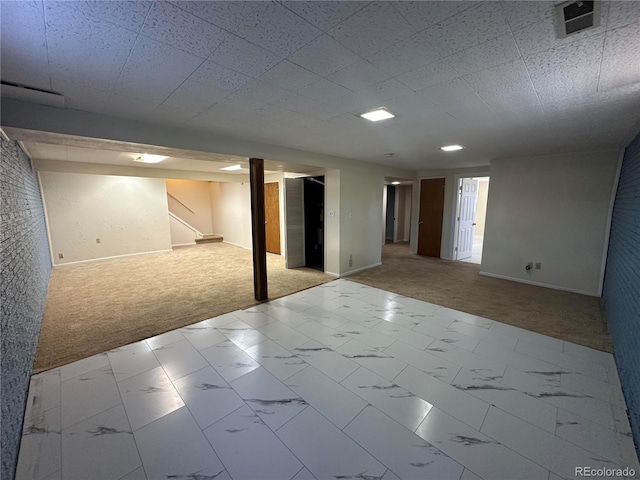11623 E Virginia Dr, Aurora, CO 80012 - finished below grade area featuring visible vents, baseboards, and carpet flooring