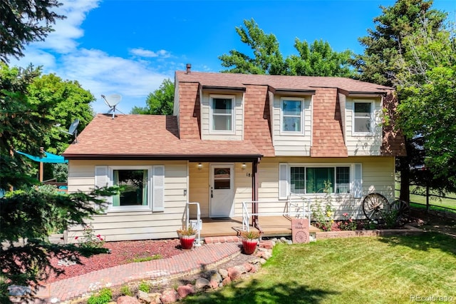 1813 Pikes Peak St, Erie, CO 80516 - view of front of property with a shingled roof, a front lawn, and a porch