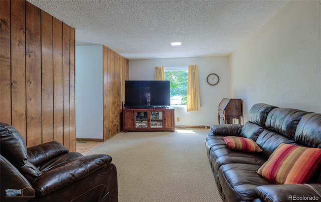 1813 Pikes Peak St, Erie, CO 80516 - living area featuring light colored carpet, a textured ceiling, and wood walls