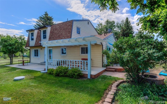 1813 Pikes Peak St, Erie, CO 80516 - back of house featuring a pergola, a patio, roof with shingles, and a wooden deck