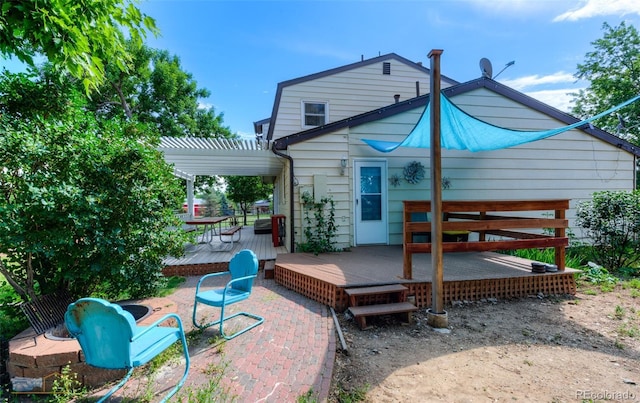 1813 Pikes Peak St, Erie, CO 80516 - back of house featuring a wooden deck and a pergola