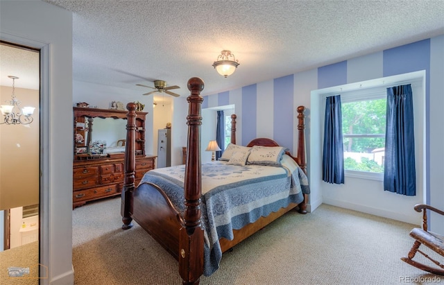1813 Pikes Peak St, Erie, CO 80516 - bedroom with carpet flooring, a textured ceiling, and a chandelier
