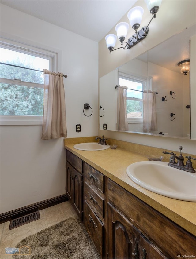 1813 Pikes Peak St, Erie, CO 80516 - full bathroom with double vanity, plenty of natural light, and a shower