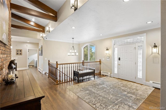 foyer entrance featuring a baseboard heating unit, a chandelier, and lofted ceiling with beams