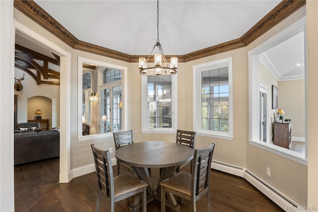 dining space with a baseboard heating unit, an inviting chandelier, and dark hardwood / wood-style floors