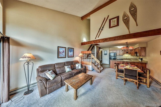 56 Gcr 834 Unit 2F, Fraser, CO 80442 - living room with beamed ceiling, a baseboard heating unit, light colored carpet, stairway, and high vaulted ceiling