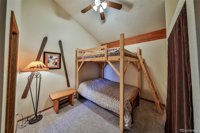 56 Gcr 834 Unit 2F, Fraser, CO 80442 - carpeted bedroom with vaulted ceiling, a textured ceiling, and a ceiling fan