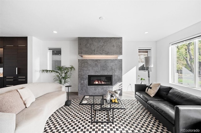 living room featuring a high end fireplace