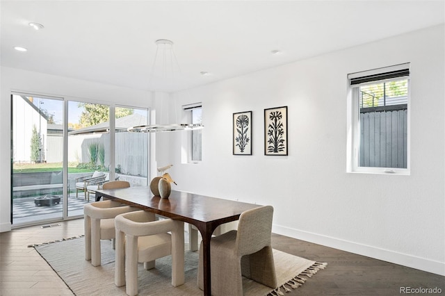 dining area with hardwood / wood-style flooring and plenty of natural light