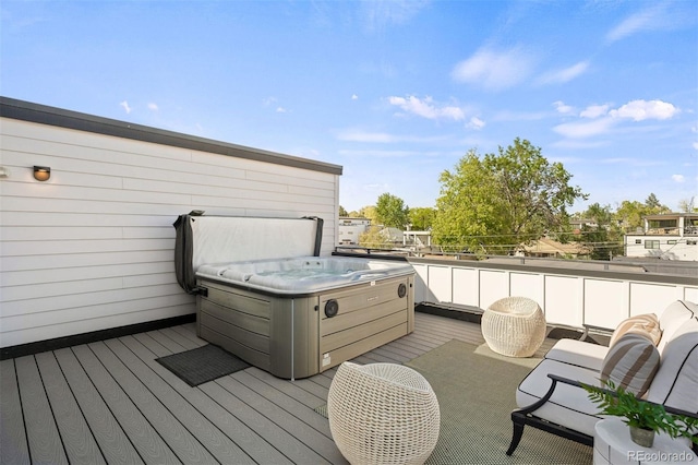 wooden deck with a hot tub