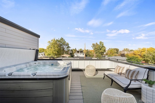 deck featuring an outdoor hangout area and a hot tub