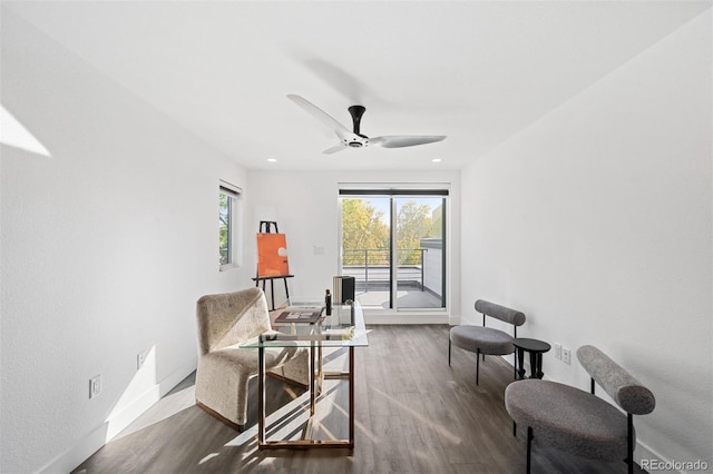 sitting room featuring ceiling fan and dark hardwood / wood-style flooring