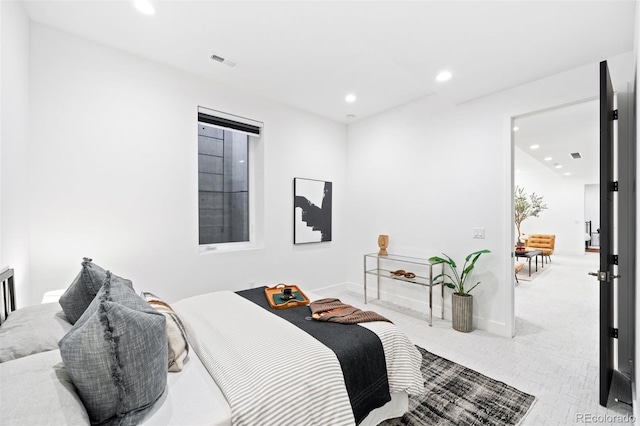 bedroom with light colored carpet