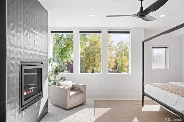 bedroom with ceiling fan and light carpet