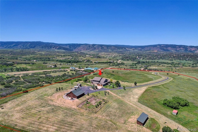 aerial view featuring a mountain view and a rural view