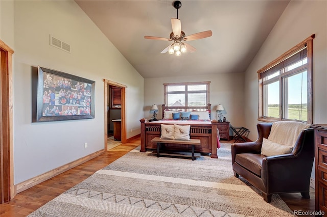 bedroom featuring ceiling fan, vaulted ceiling, and light hardwood / wood-style flooring