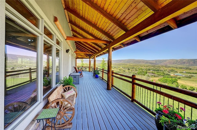 deck featuring a mountain view and a rural view