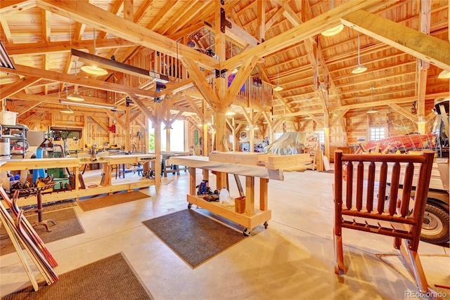 interior space with wood ceiling, wooden walls, high vaulted ceiling, and beamed ceiling