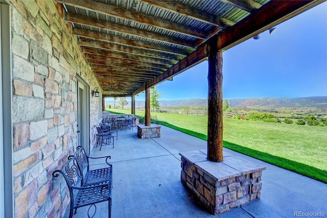 view of patio / terrace featuring a mountain view