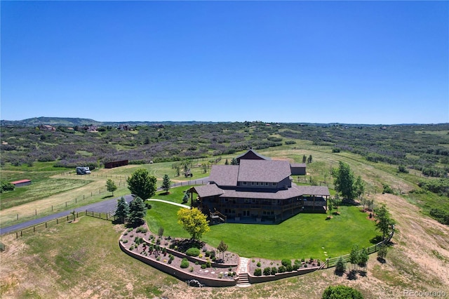 birds eye view of property with a rural view