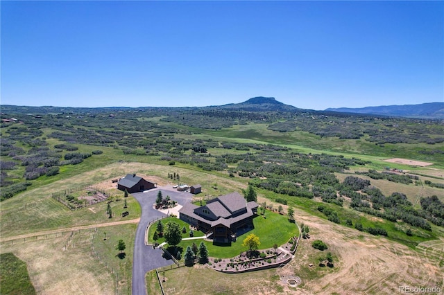 drone / aerial view with a mountain view and a rural view