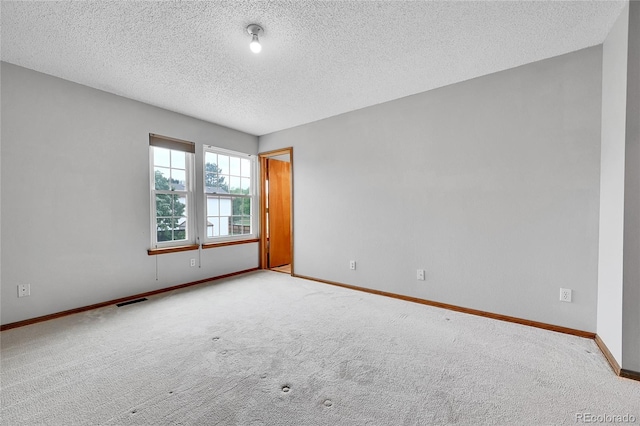 13008 Grove Way, Broomfield, CO 80020 - unfurnished room featuring baseboards, carpet, and a textured ceiling