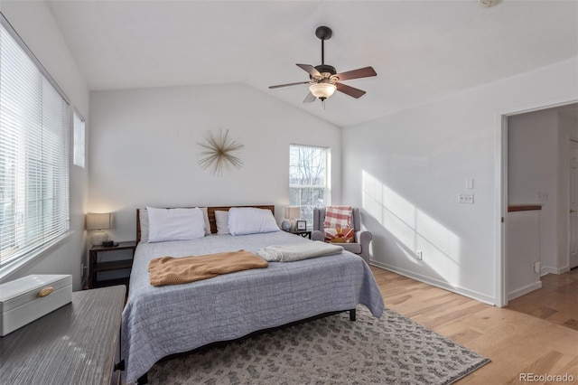 bedroom featuring vaulted ceiling, ceiling fan, and hardwood / wood-style floors