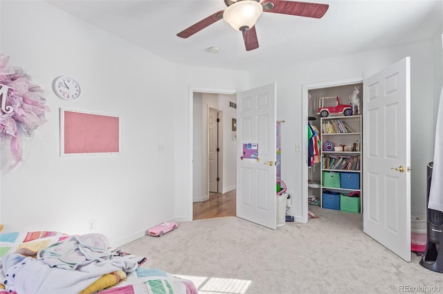 bedroom with light carpet and ceiling fan