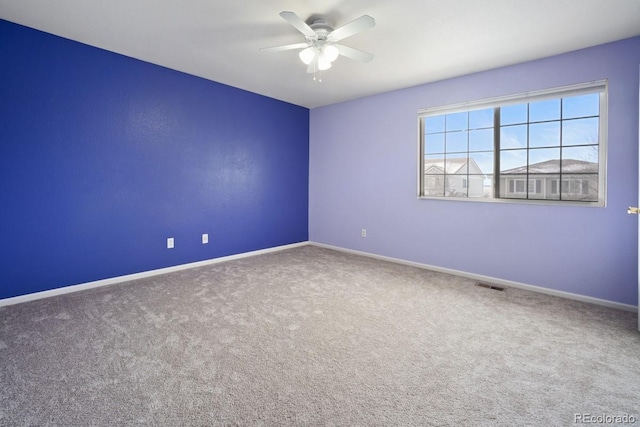 carpeted empty room with ceiling fan