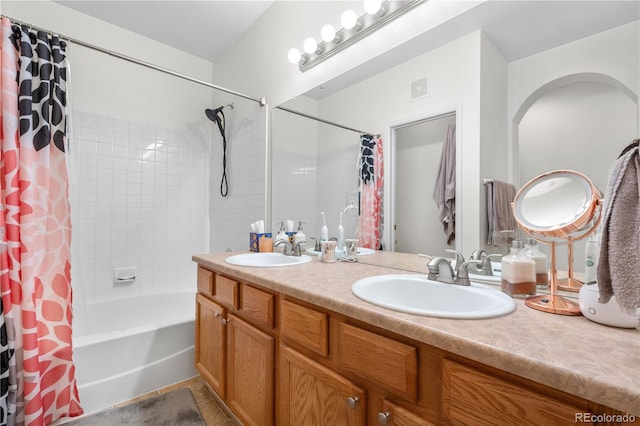 bathroom with double vanity, shower / bath combo, and tile patterned flooring