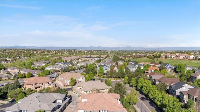 aerial view of residential area featuring mountains