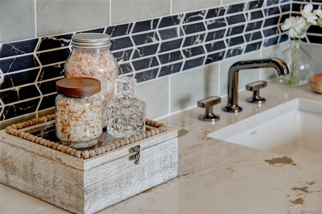 interior details with sink and tasteful backsplash