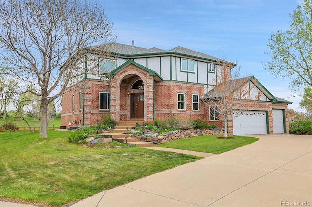 3970 Pierson St, Wheat Ridge, CO 80033 - tudor house with concrete driveway, brick siding, a front lawn, and a garage